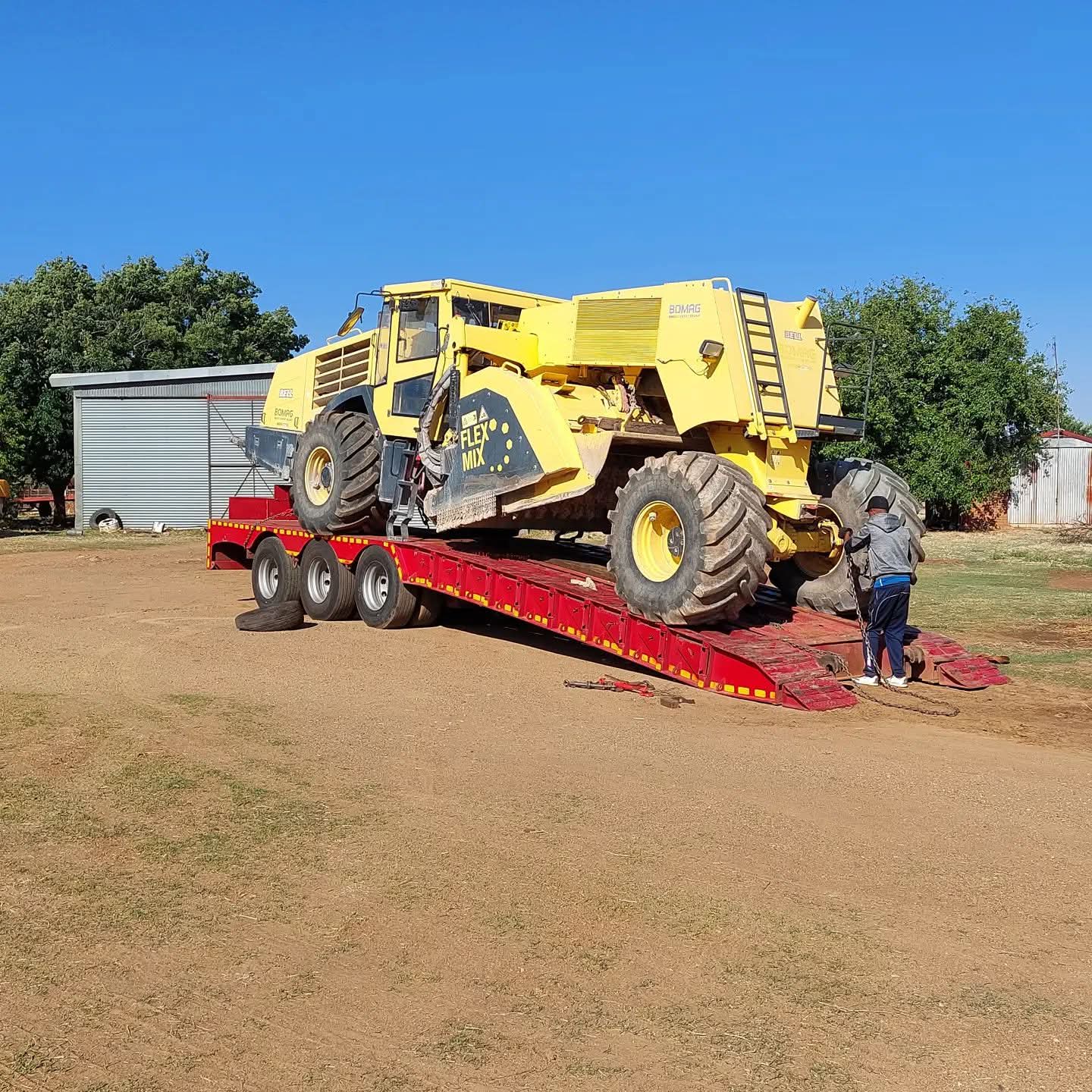 Equipment being prepared for transport. Nicolaas is experienced with CAT and BOMAG machinery.